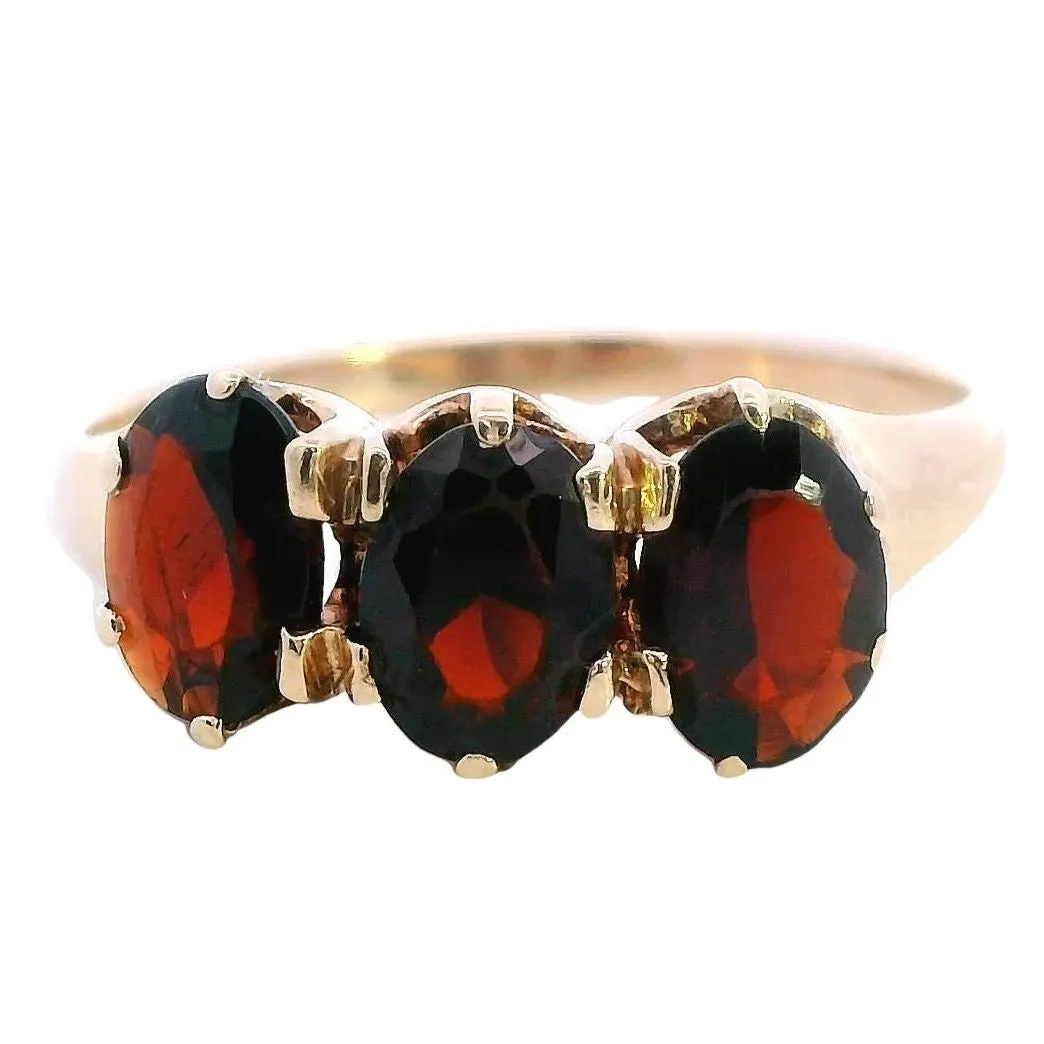 A Treasure of Timeless Elegance 9ct Yellow Gold 3 stone Garnet Ring