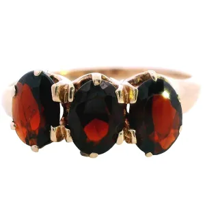 A Treasure of Timeless Elegance 9ct Yellow Gold 3 stone Garnet Ring